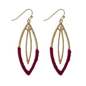 Interlocking oval earrings with magenta threads